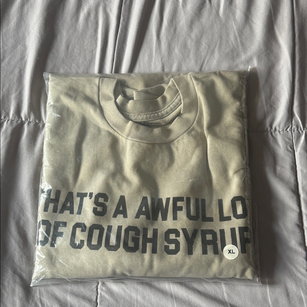 Beige Graphic L/S Tee that says "That's A Awful Lot Of Cough Syrup"